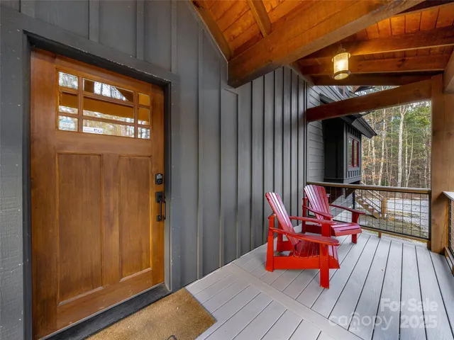 a balcony with furniture and wooden floor