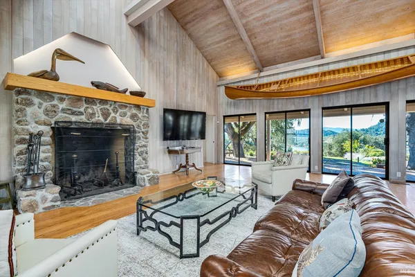 a living room with furniture and a painting