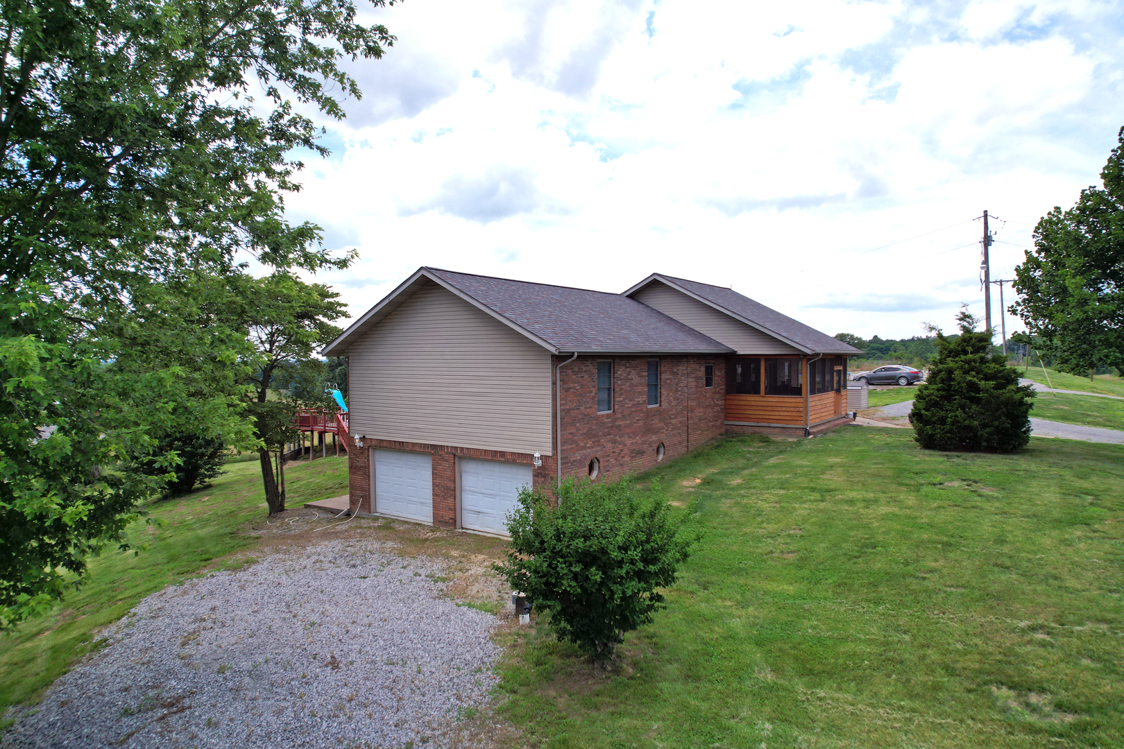 5488 Tick Ridge Road Grand Chain, IL 62941 - Photo 5 of 55 a view of a house with a yard and a garden