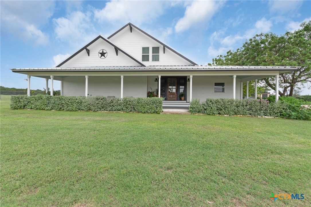 front view of a house with a yard