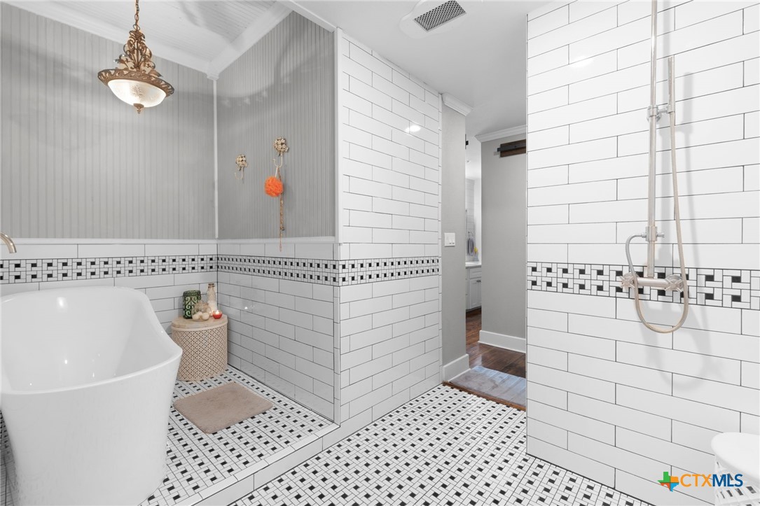 951 Moseley Road Copperas Cove, TX 76522 - Photo 23 of 43 a bathroom with a sink a toilet and shower
