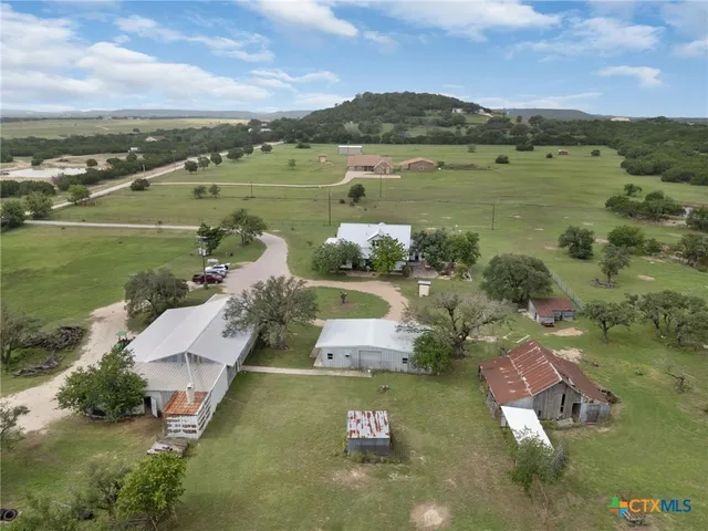 an aerial view of a house with a lake view