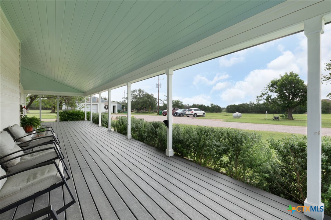 951 Moseley Road Copperas Cove, TX 76522 - Photo 5 of 43 a view of a balcony with lake view and a floor to ceiling window