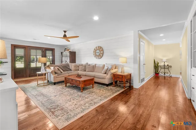 a living room with furniture and a table