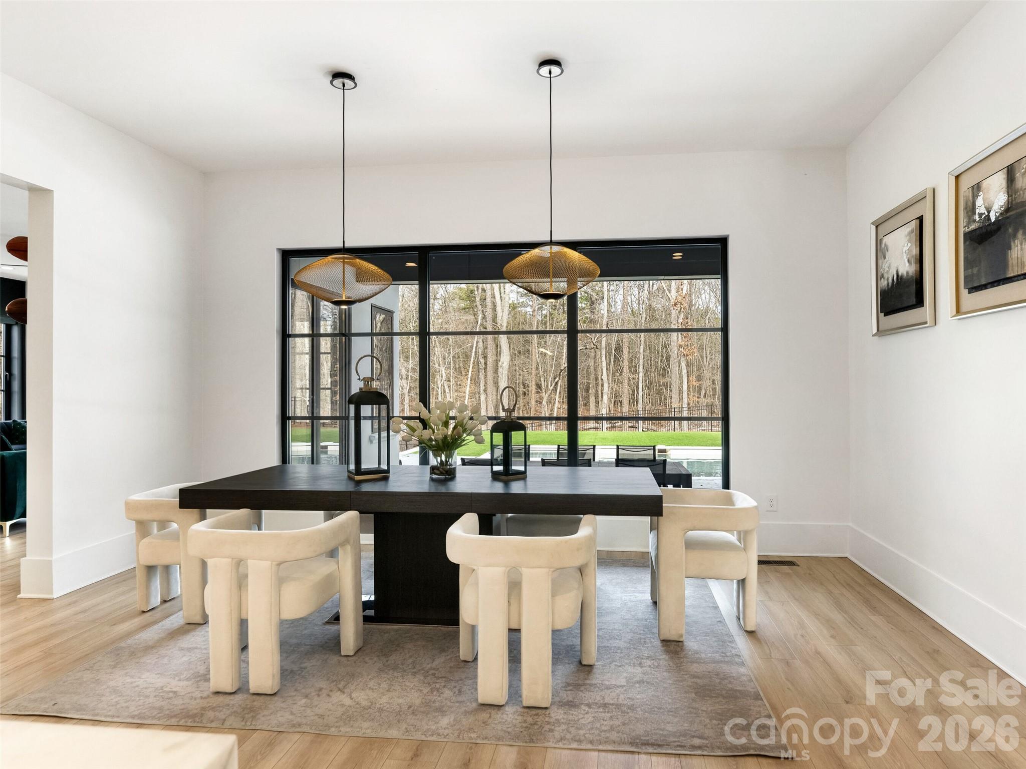 6017 Oxfordshire Road Waxhaw, NC 28173 - Photo 15 of 48 a room with a large window and chairs