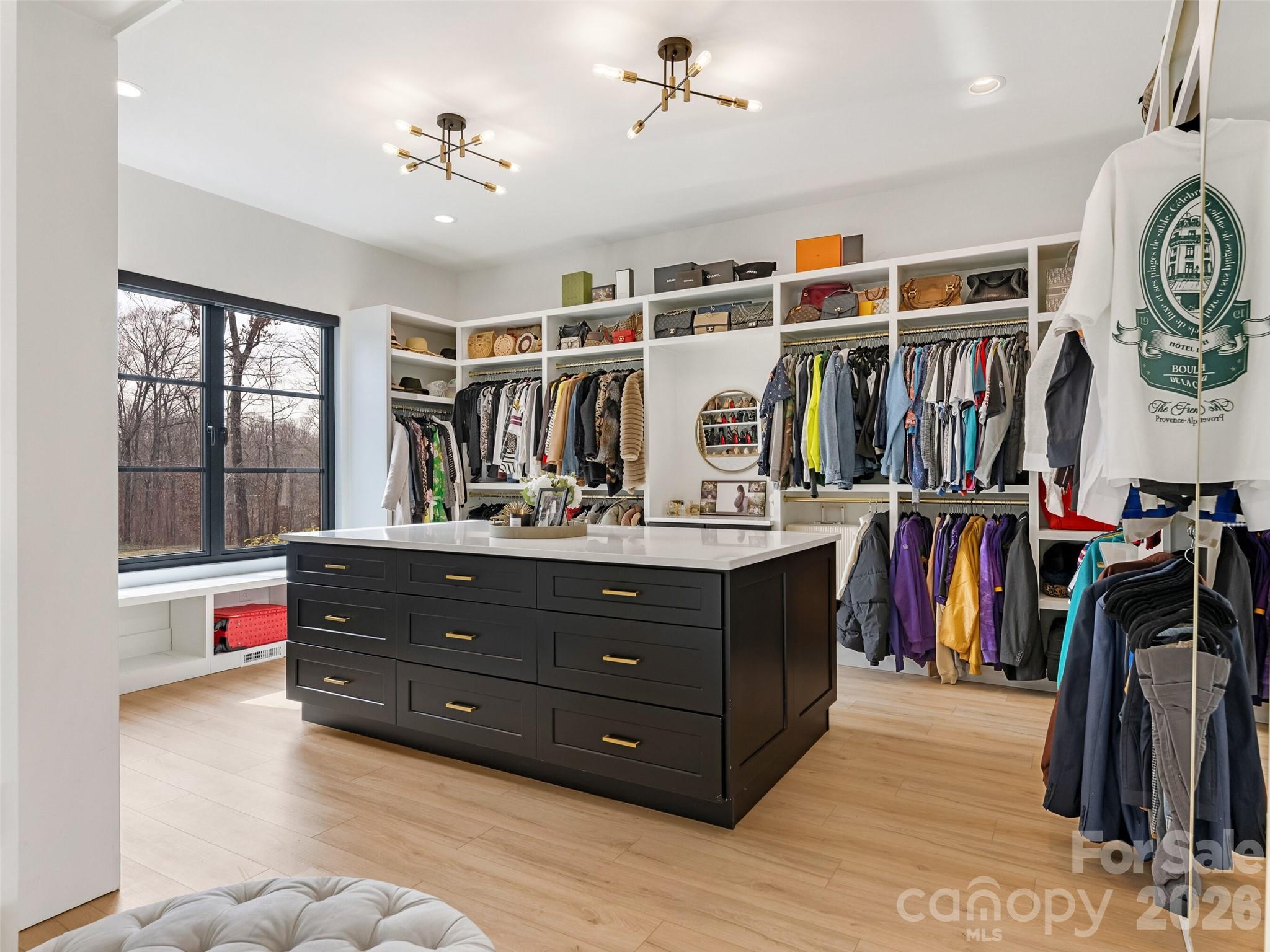 6017 Oxfordshire Road Waxhaw, NC 28173 - Photo 24 of 48 a view of walk in closet with clothes and shoes