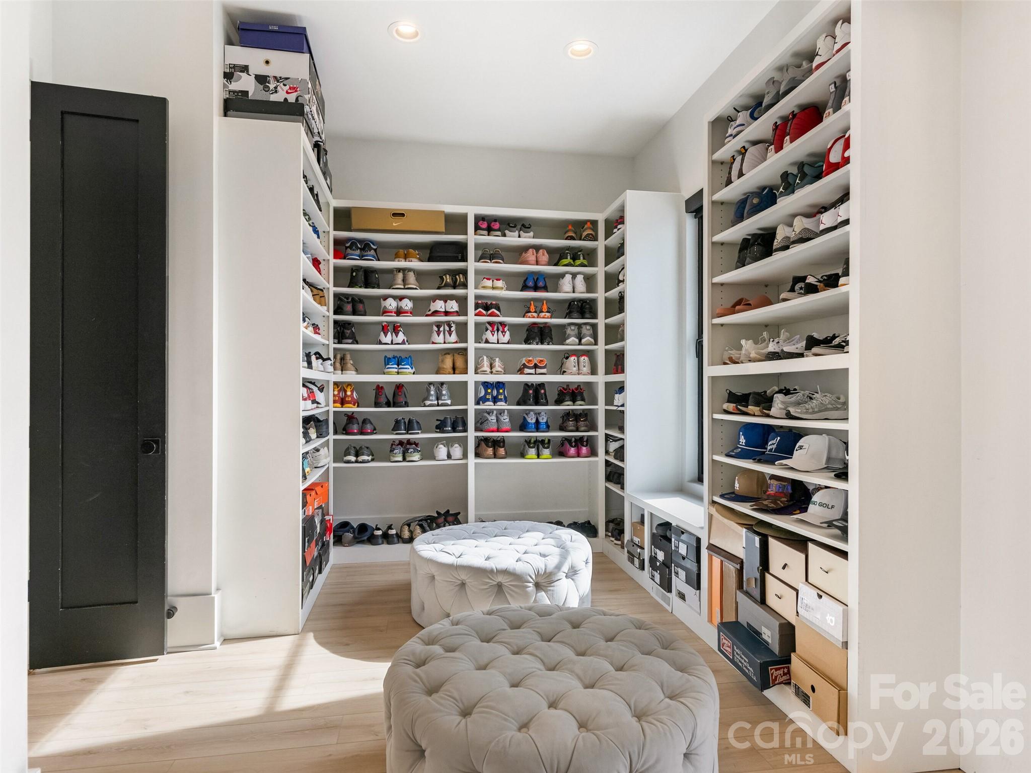 6017 Oxfordshire Road Waxhaw, NC 28173 - Photo 25 of 48 a view of walk in closet with clothes and shoes