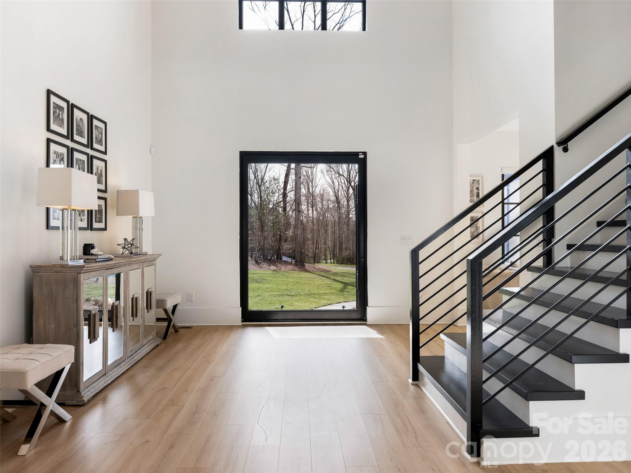 6017 Oxfordshire Road Waxhaw, NC 28173 - Photo 3 of 48 a view of entryway with wooden floor