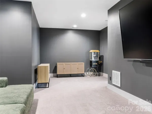 a living room with furniture and a chair