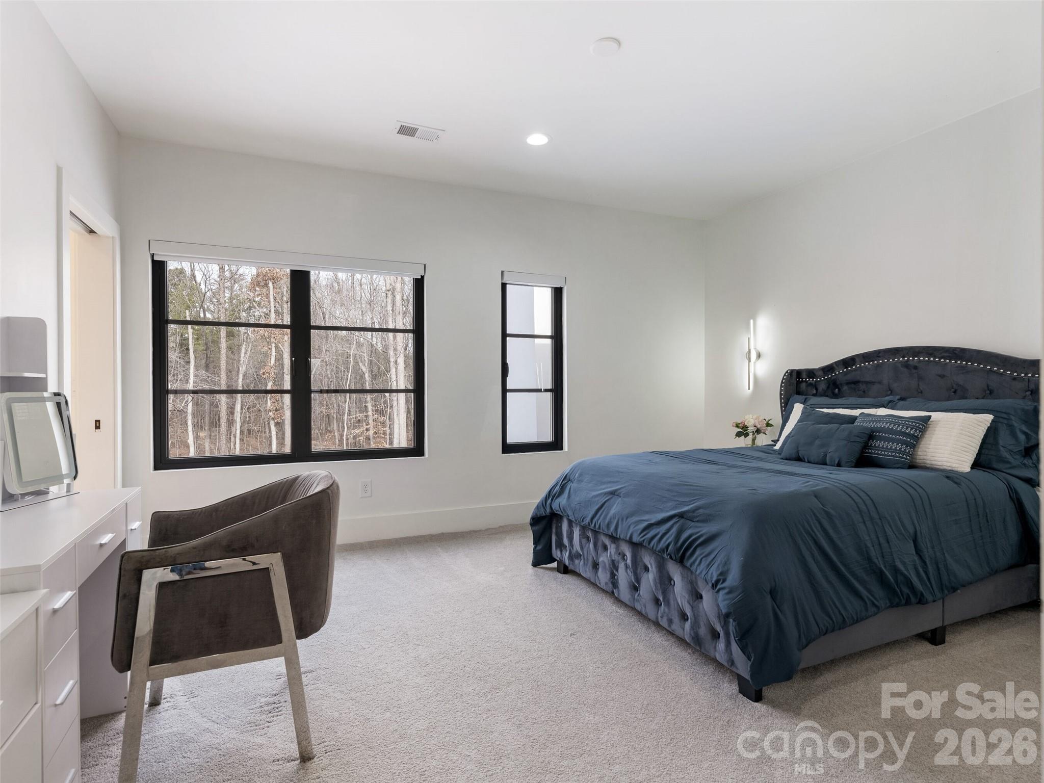 6017 Oxfordshire Road Waxhaw, NC 28173 - Photo 35 of 48 a bedroom with a large bed and a window