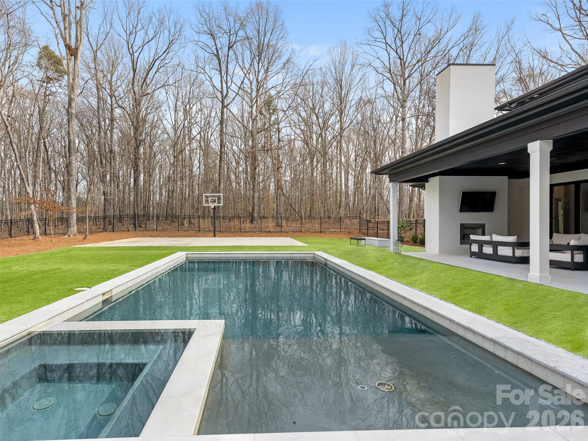 6017 Oxfordshire Road Waxhaw, NC 28173 - Photo 44 of 48 a view of a swimming pool with a yard