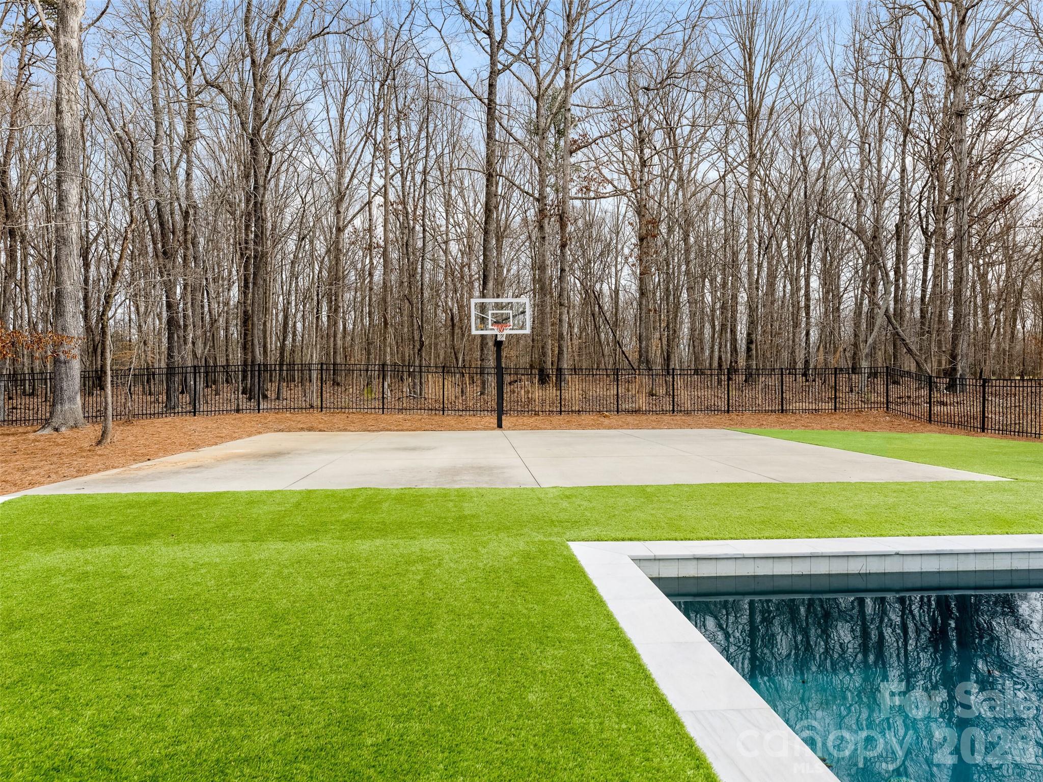 6017 Oxfordshire Road Waxhaw, NC 28173 - Photo 45 of 48 a view of a swimming pool with a park