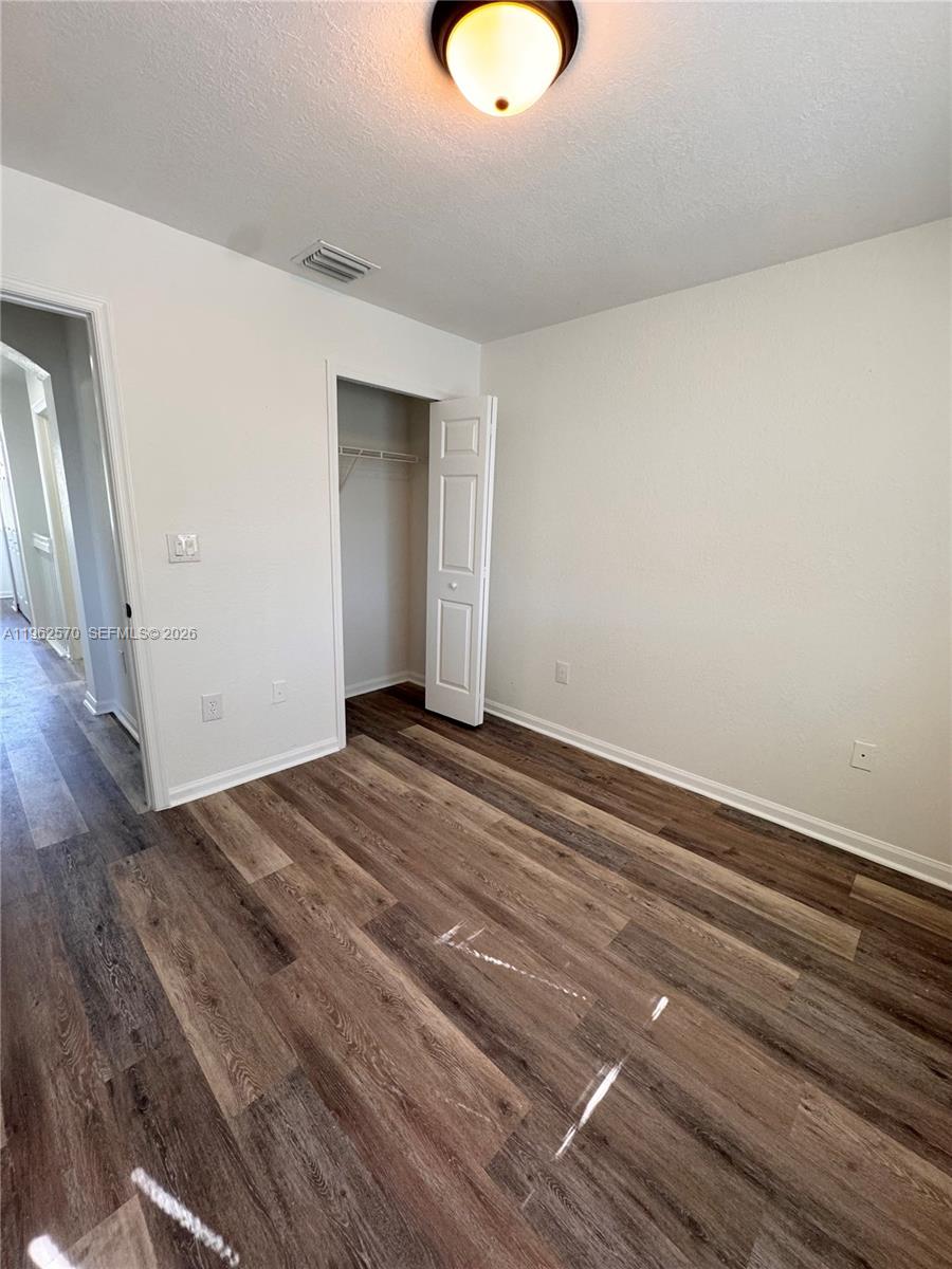 2732 Southeast 15th Place, Unit 142 Homestead, FL 33035 - Photo 14 of 20 a view of a room with wooden floor