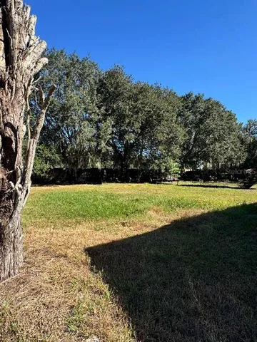a view of a golf course with a lake
