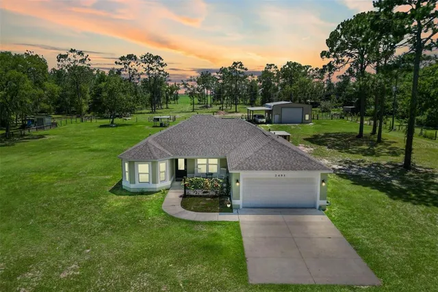 a aerial view of a house with garden
