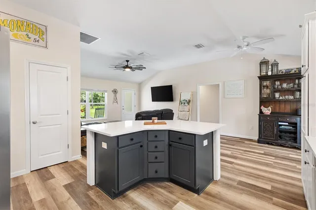 a kitchen with a sink a cabinets and window