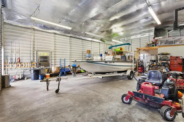 a storage room with lots of clutter and cars