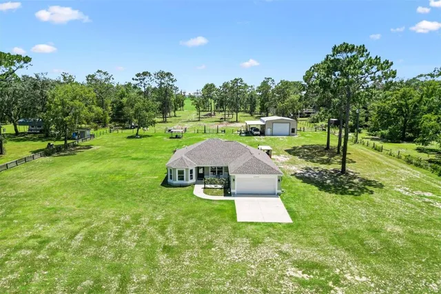 a view of a garden with an outdoor space and seating