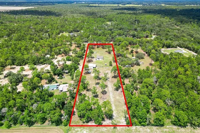 a wooden floor with a yard and sitting area