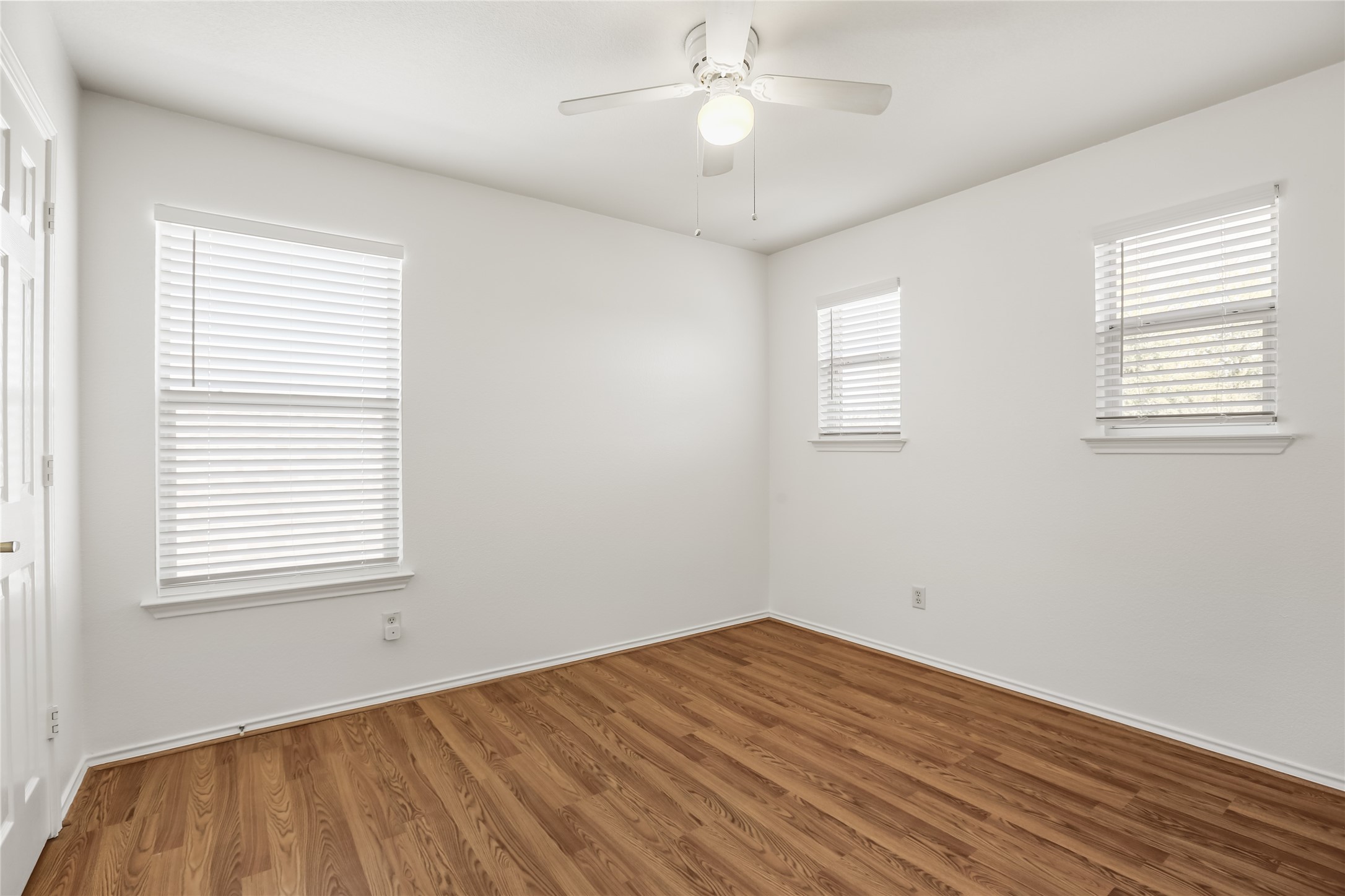2010 Ashberry Trail Georgetown, TX 78626 - Photo 18 of 24 Empty room featuring wood finished floors and ceiling fan