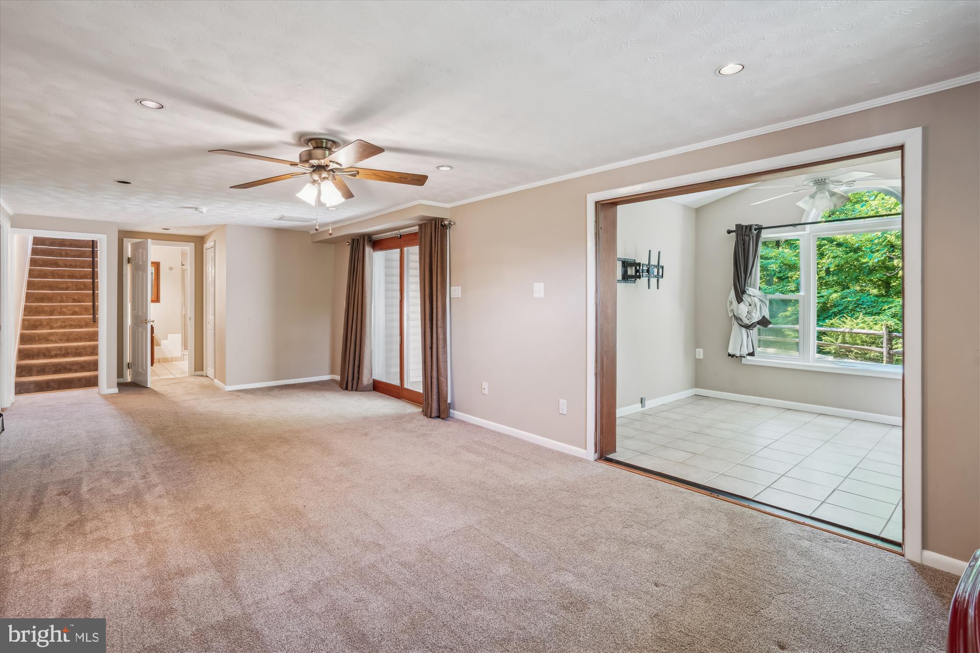 4642 Roundhill Road Ellicott City, MD 21043 - Photo 16 of 29 Recreation Room with walk out level glass doors