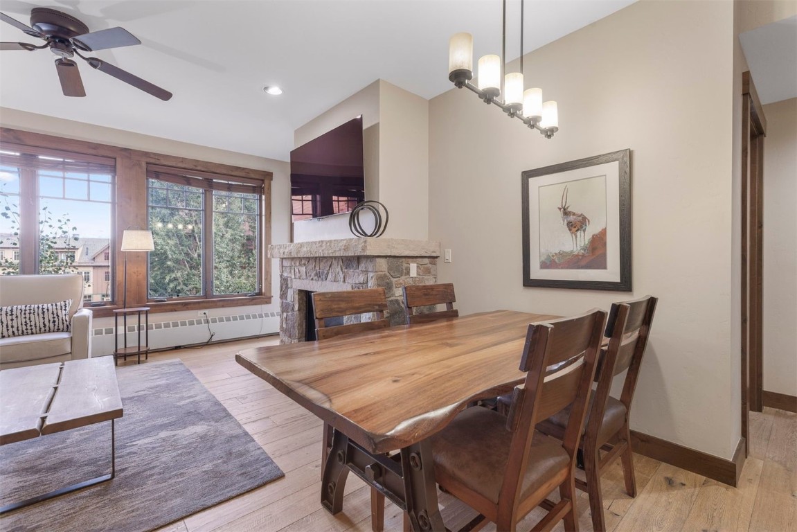 610 Columbine Road, Unit 6307 Breckenridge, CO 80424 - Photo 12 of 36 a living room with furniture a fireplace and a flat screen tv