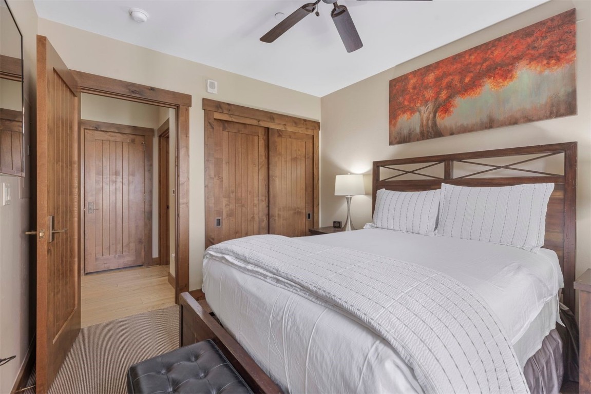 610 Columbine Road, Unit 6307 Breckenridge, CO 80424 - Photo 24 of 36 a bedroom with a bed and a painting on the wall