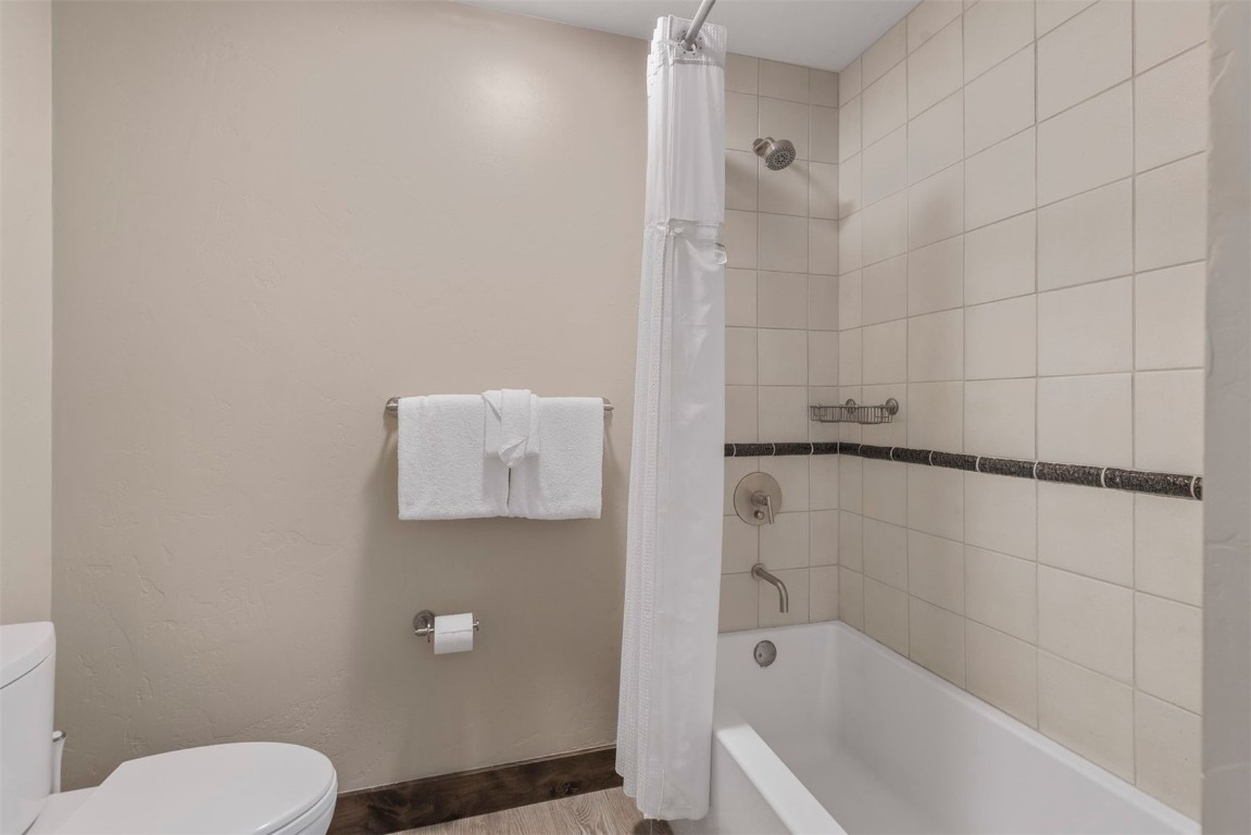 610 Columbine Road, Unit 6307 Breckenridge, CO 80424 - Photo 26 of 36 a bathroom with a toilet and a shower