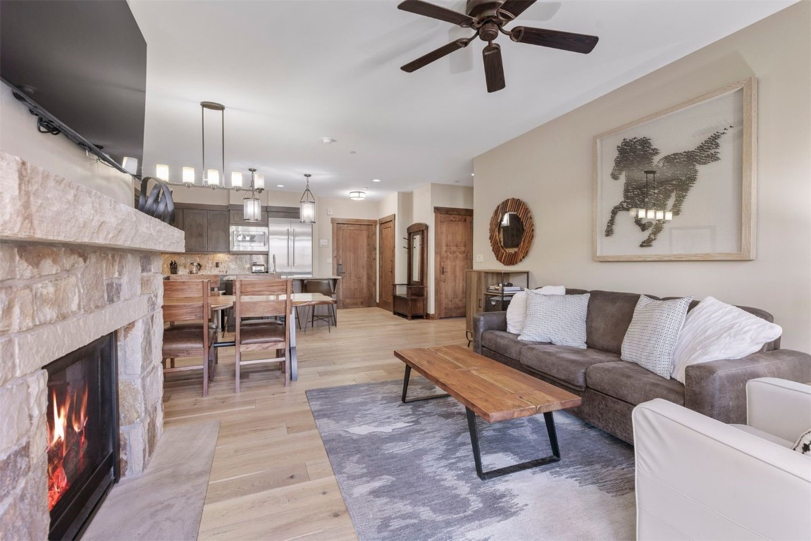610 Columbine Road, Unit 6307 Breckenridge, CO 80424 - Photo 3 of 36 a living room with furniture and a fireplace