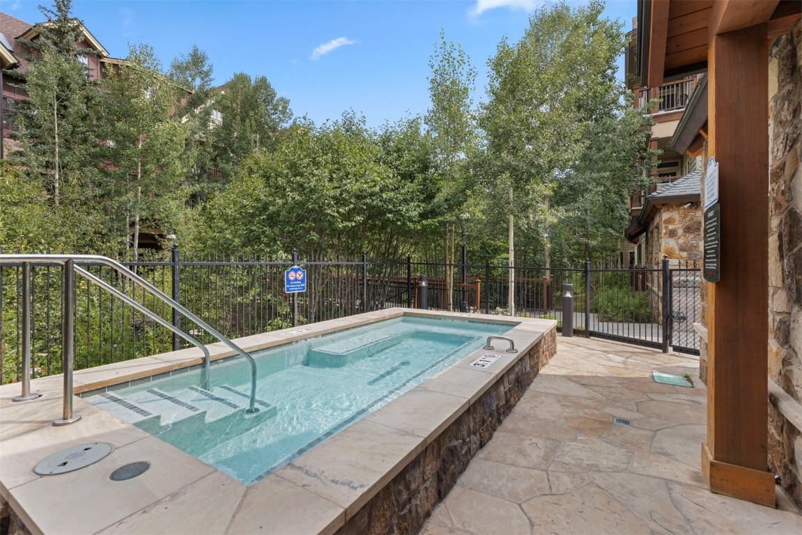 610 Columbine Road, Unit 6307 Breckenridge, CO 80424 - Photo 33 of 36 a view of a backyard with swimming pool