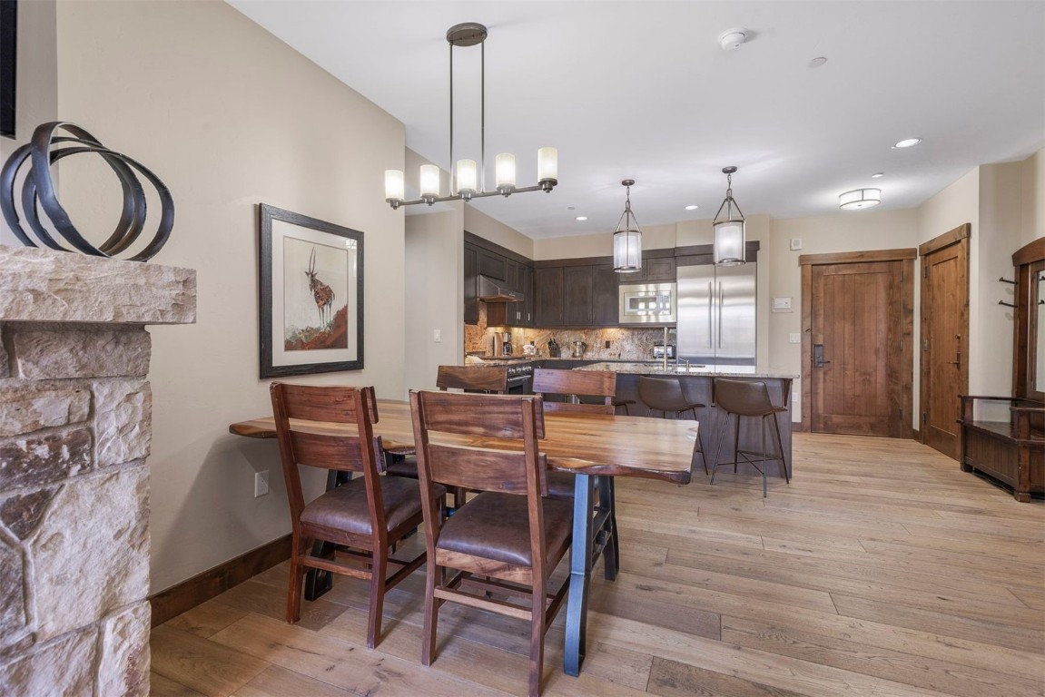610 Columbine Road, Unit 6307 Breckenridge, CO 80424 - Photo 6 of 36 a view of a dining room with furniture