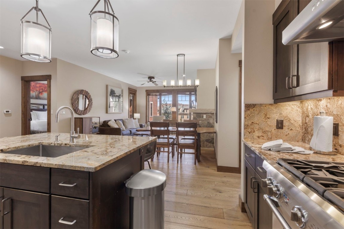 610 Columbine Road, Unit 6307 Breckenridge, CO 80424 - Photo 9 of 36 a kitchen with granite countertop a stove and a sink