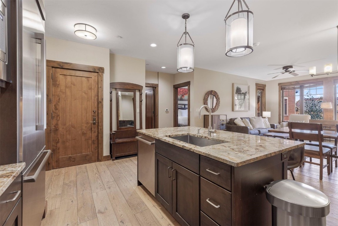 610 Columbine Road, Unit 6307 Breckenridge, CO 80424 - Photo 10 of 36 a large kitchen with a table and chairs