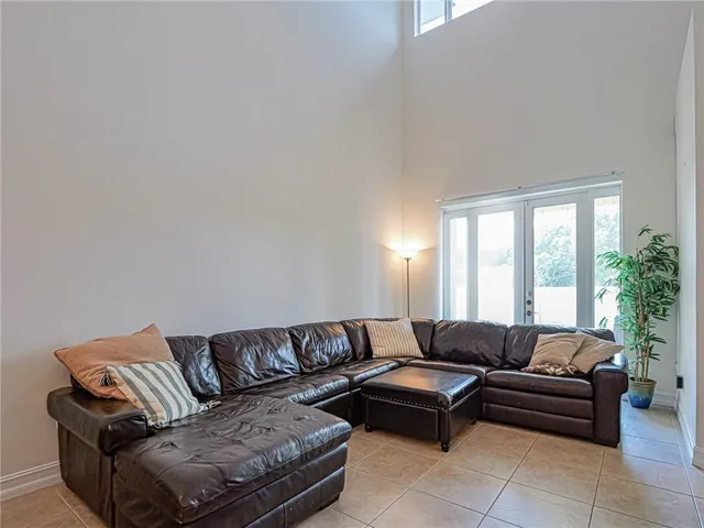 a living room with a couch and a large window