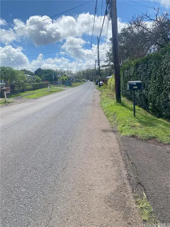 a view of a road with a yard
