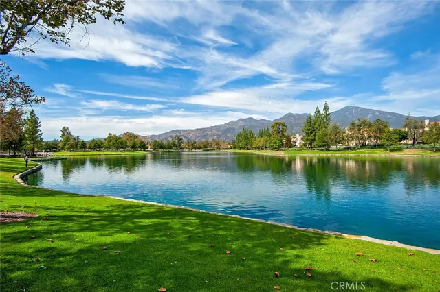 a view of a lake with houses in the back