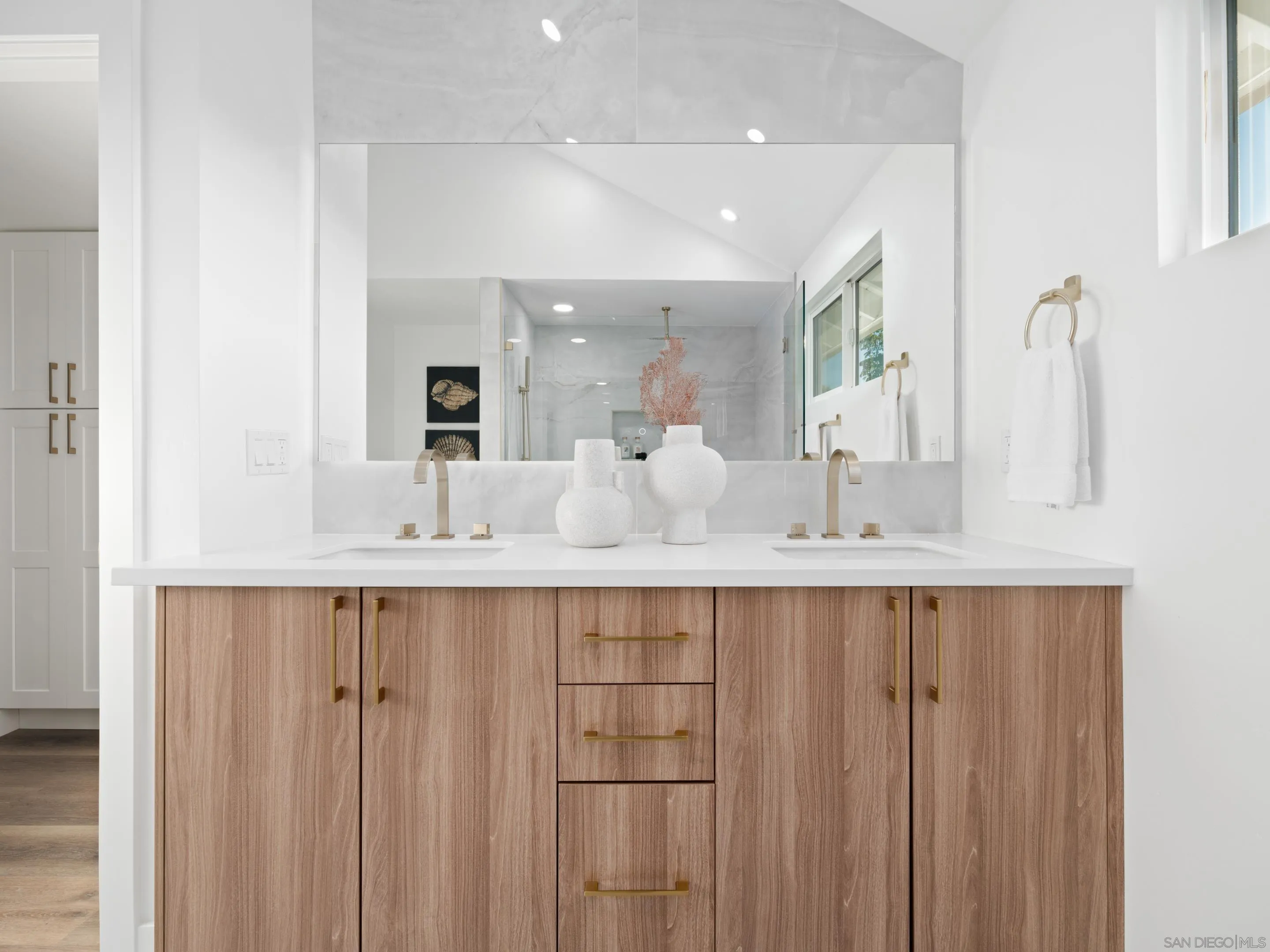 1868 Pariva Drive Cardiff, CA 92007 - Photo 13 of 30 a bathroom with a double vanity sink and a mirror