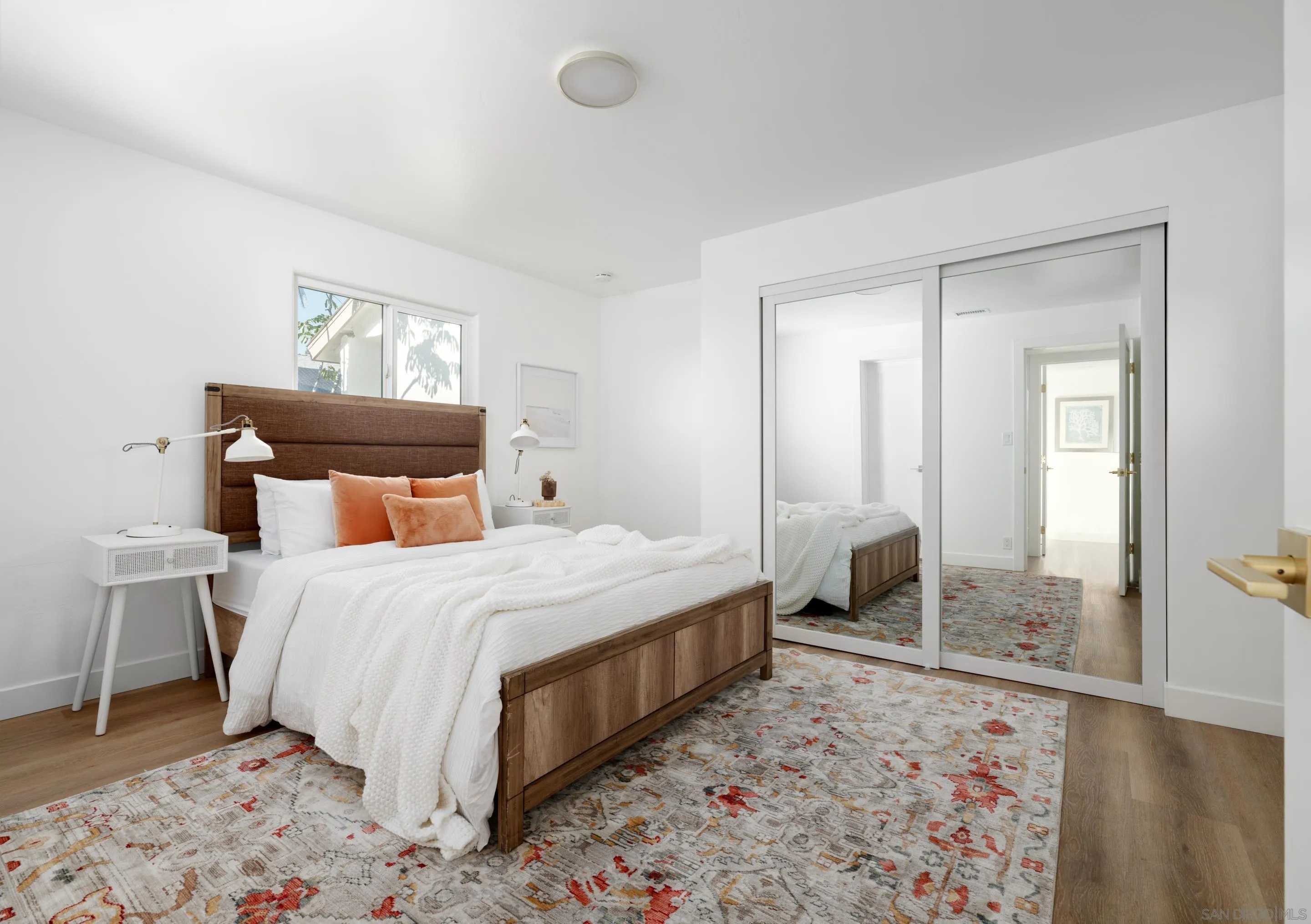 1868 Pariva Drive Cardiff, CA 92007 - Photo 17 of 30 a bedroom with a bed and wooden floor