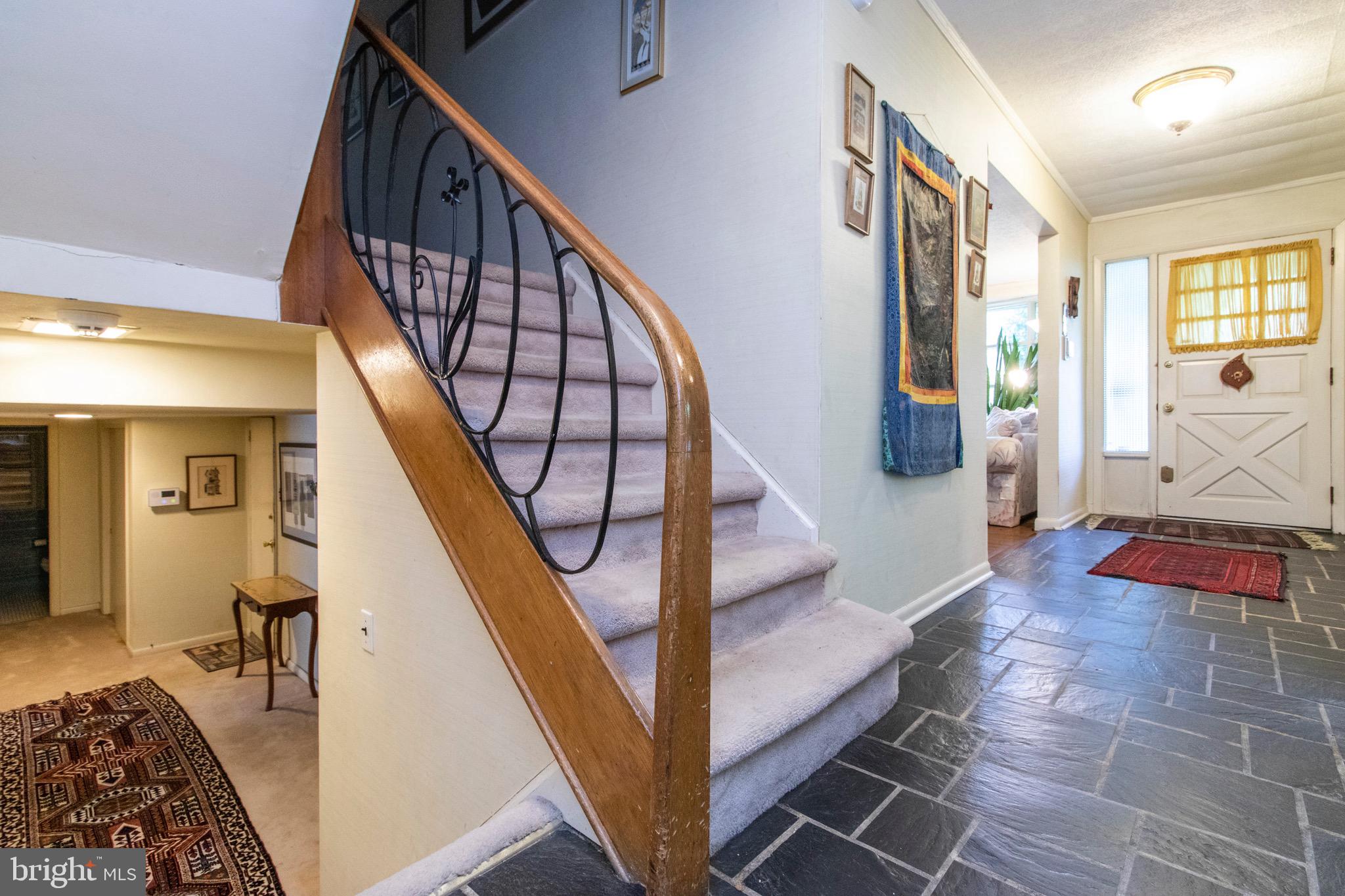 1841 Cobden Road Glenside, PA 19038 - Photo 12 of 20 Main hallway, slate floor, wrought Iron railing