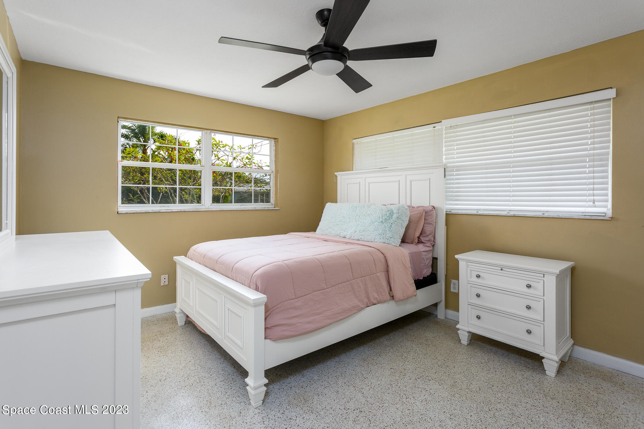 608 Mango Drive Melbourne Beach, FL 32951 - Photo 15 of 30 a bedroom with a bed and a dresser