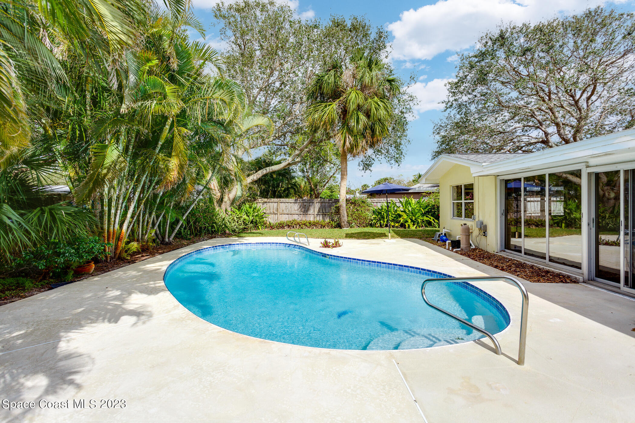 608 Mango Drive Melbourne Beach, FL 32951 - Photo 2 of 30 a view of outdoor space and swimming pool