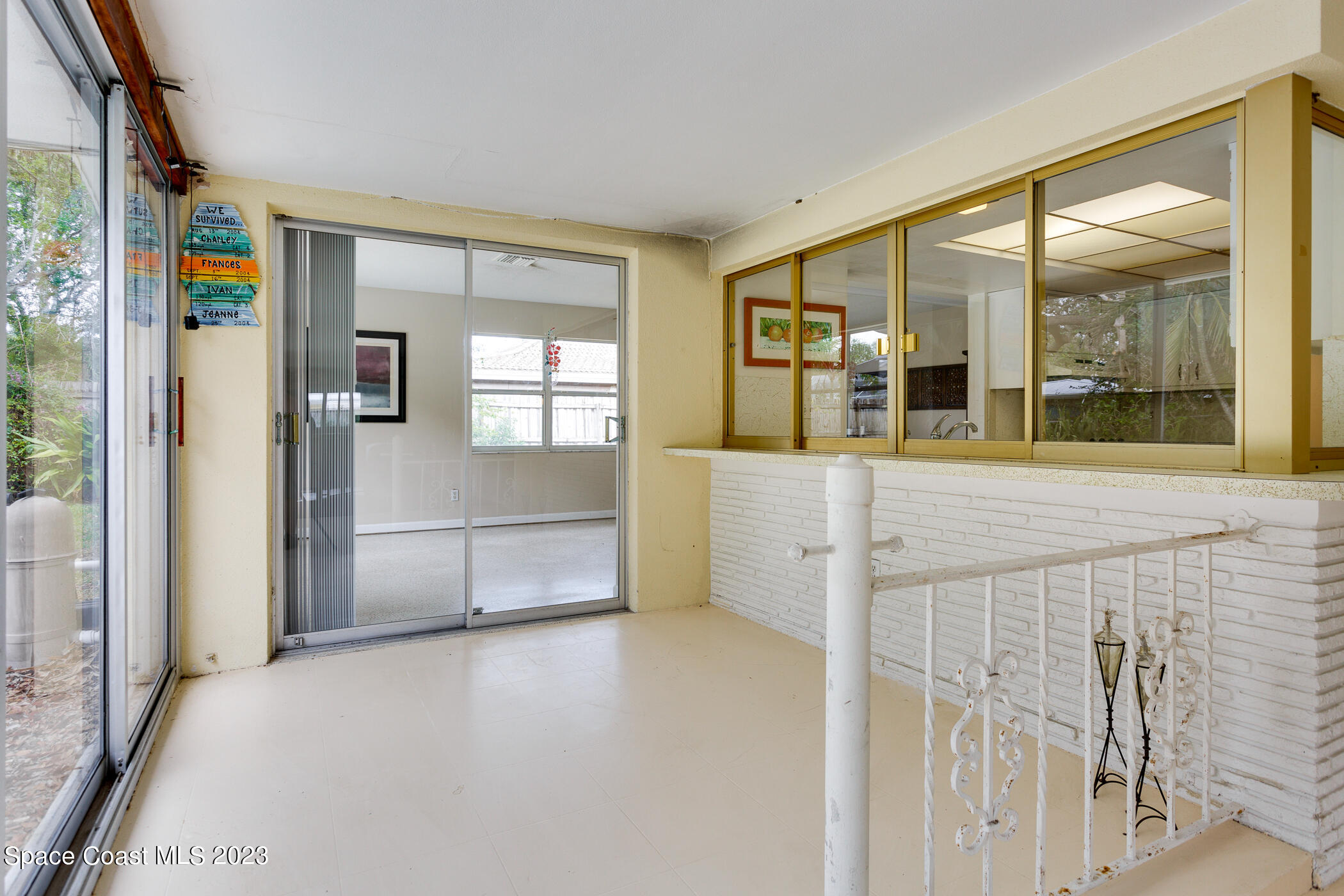 608 Mango Drive Melbourne Beach, FL 32951 - Photo 22 of 30 a view of a entrance door of the house