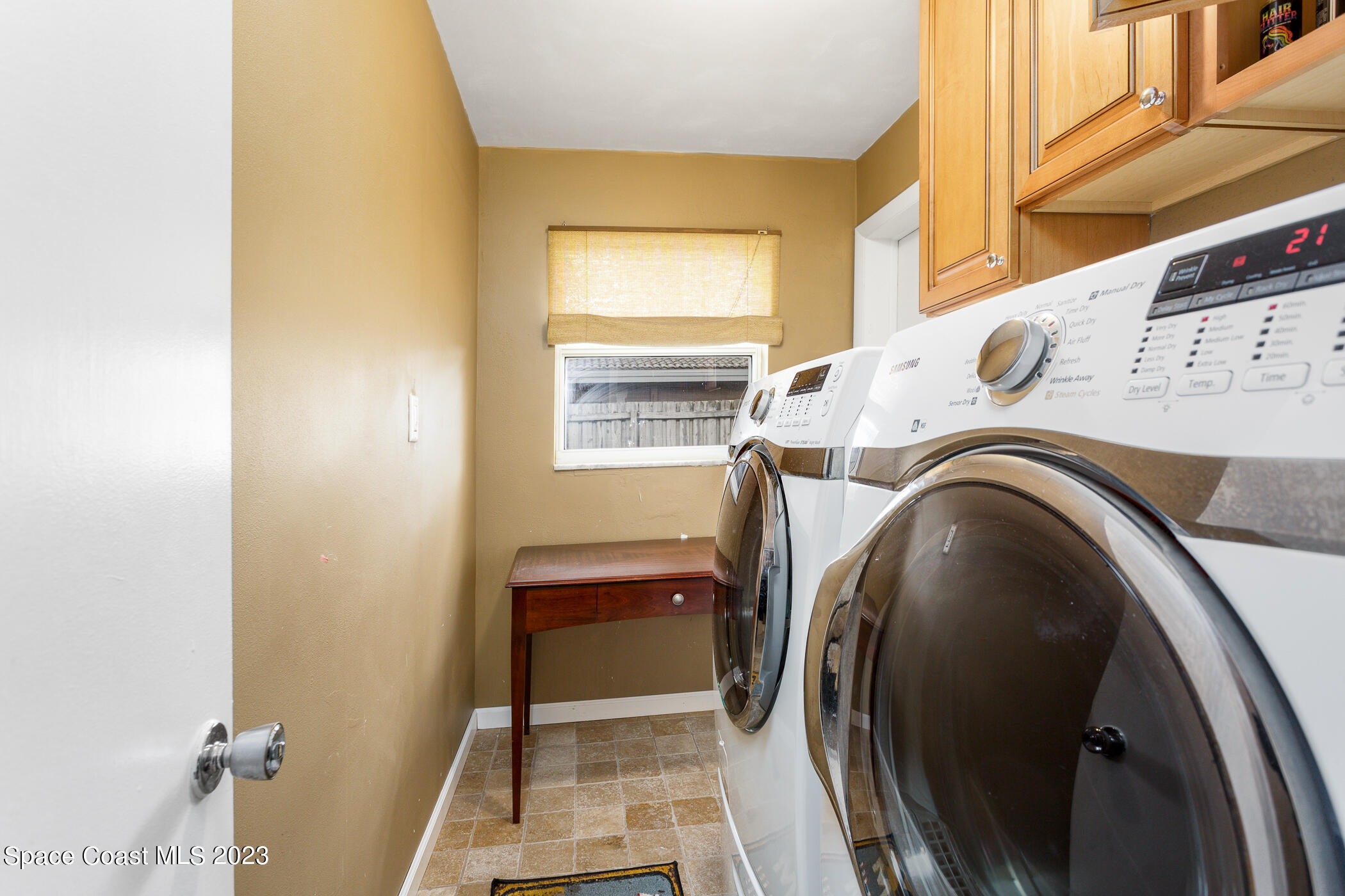 608 Mango Drive Melbourne Beach, FL 32951 - Photo 25 of 30 a utility room with dryer and washer