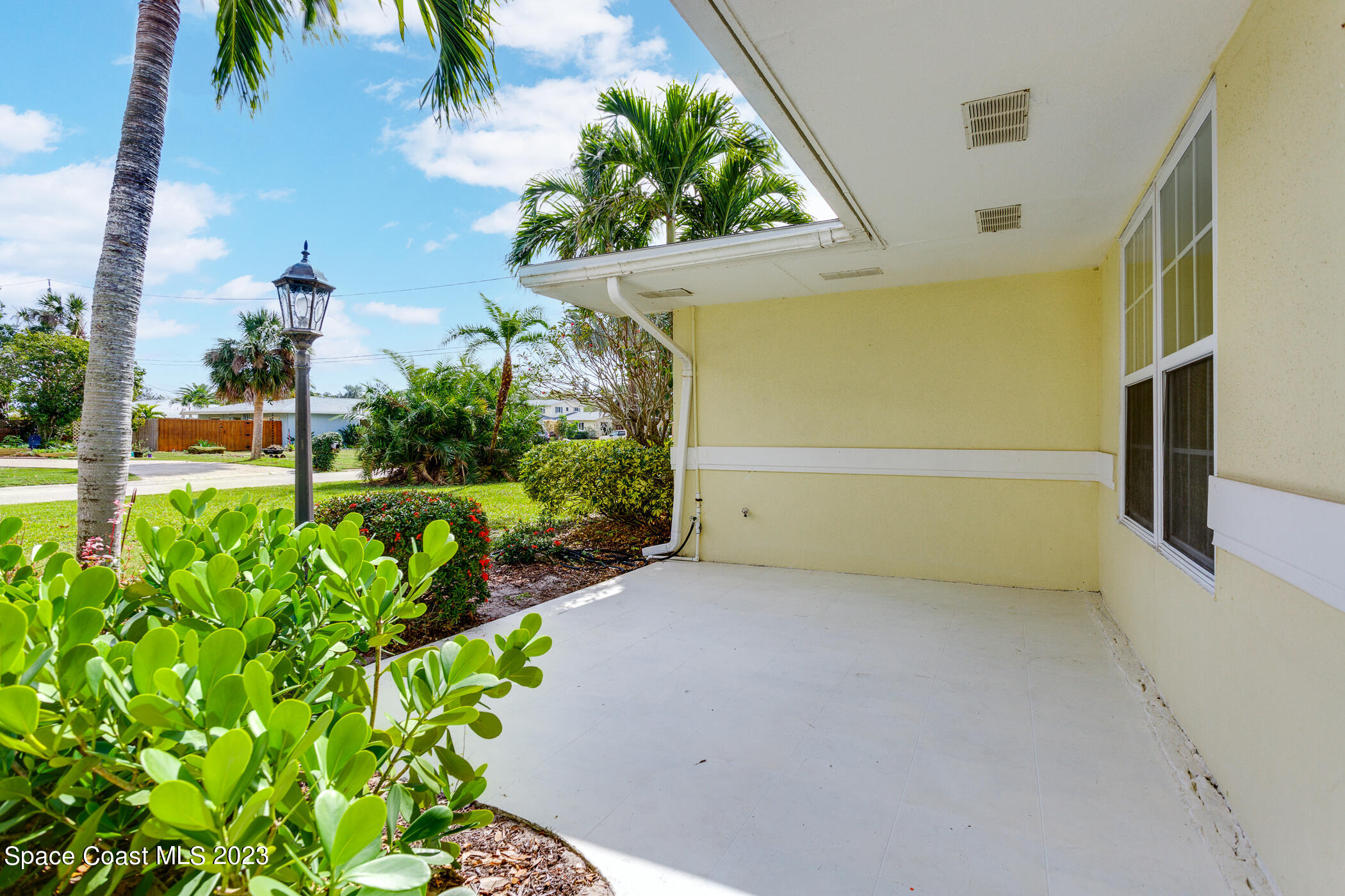 608 Mango Drive Melbourne Beach, FL 32951 - Photo 28 of 30 a view of a back yard of the house