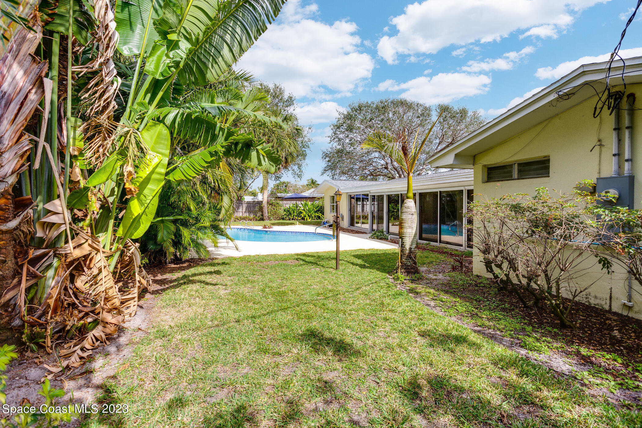 608 Mango Drive Melbourne Beach, FL 32951 - Photo 29 of 30 a view of house with backyard
