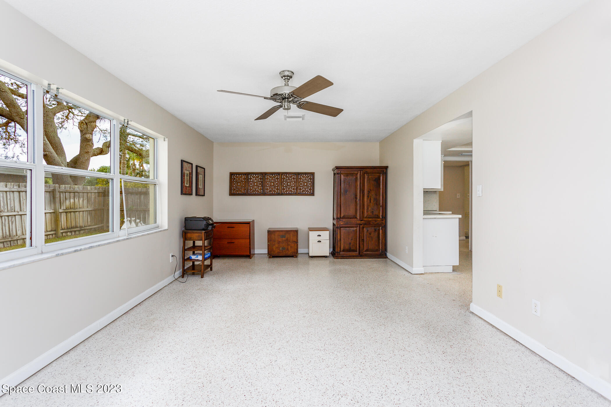 608 Mango Drive Melbourne Beach, FL 32951 - Photo 10 of 30 an empty room with windows and ceiling fan