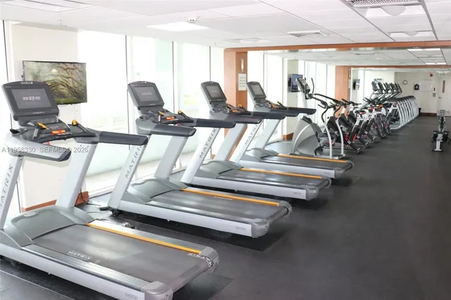 a front view of a building with windows and swimming pool