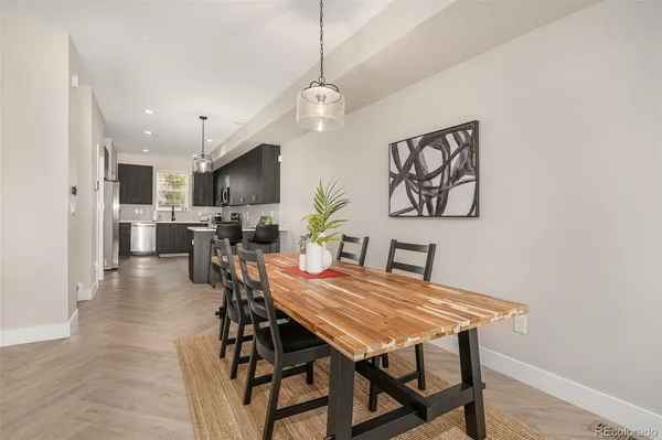 a dining room with furniture and window