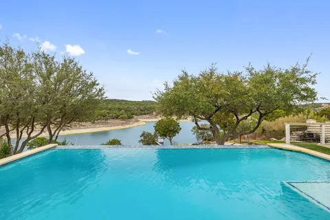 a view of a lake with houses in the background