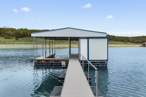 an aerial view of a house with a lake view